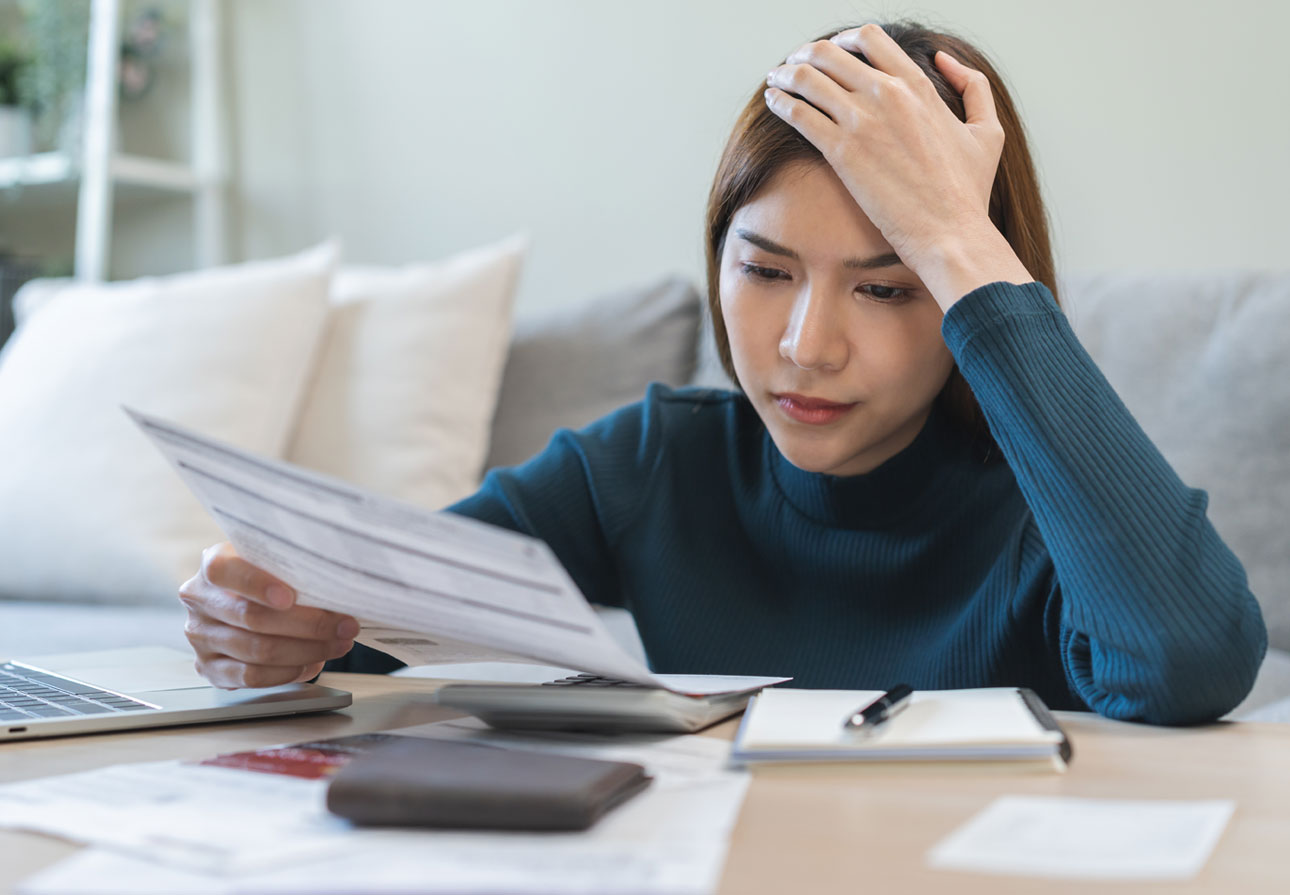 a young woman stressed over financial concerns.