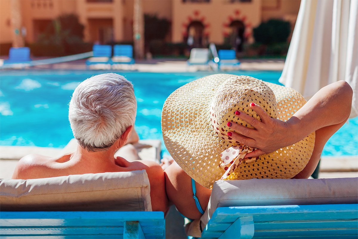 Senior couple enjoying leisure time at the pool