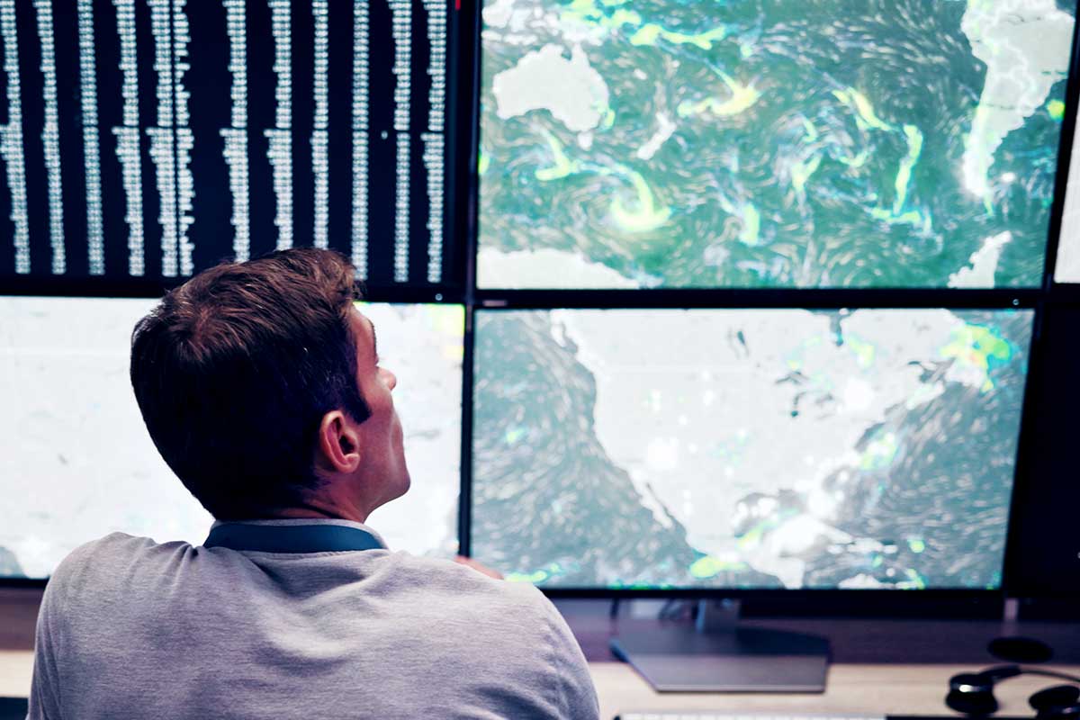 Meteorologist Watching Tropics on Screens