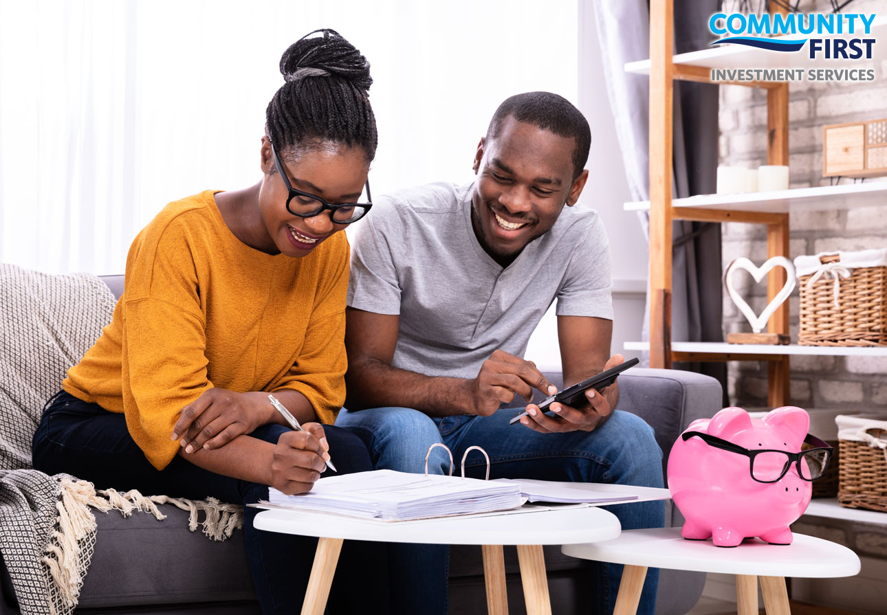 a young couple reviewing their investments.