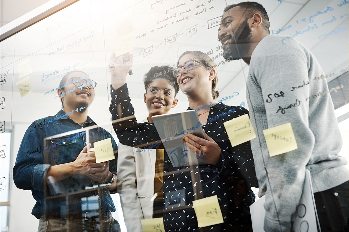 4 Business Professionals Analyzing Data