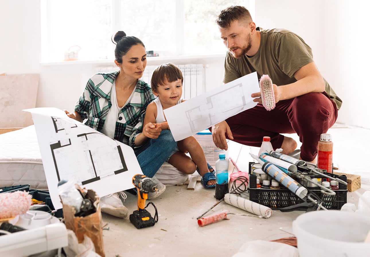 a family looking through their plans for home renovation